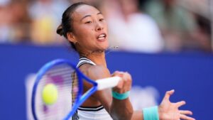 Zheng Qinwen, of China, returns the ball to Iga Swiatek, of Poland, during the fourth round of the U.S. Open championships, Monday, Sept. 7, 2026, in New York. (Seth Wenig)