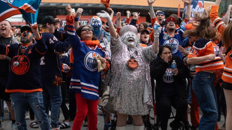 Oilers fans cheer as they watch the Edmonton Oilers score against the Florida Panthers during a watch party for Game 5 of the Stanley Cup final, in Edmonton on Tuesday, June 18, 2024. (Jason Franson/CP)