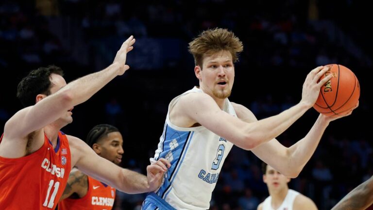 North Carolina center Henri Veesaar, right, looks to pass against Clemson forward Nick Davidson during the first half of an NCAA college basketball game in the quarterfinals of the Atlantic Coast Conference tournament in Charlotte, N.C., Thursday, March 12, 2026. (Nell Redmond/AP)