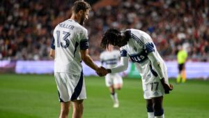 Vancouver Whitecaps forwards Yadaly Diaby (77) and Thomas Müller (13) celebrate after a goal scored by Diaby during an MLS soccer match against Real Salt Lake, Saturday, Sept. 19, 2026, in Sandy, Utah. (Tyler Tate/AP)