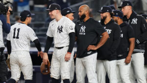 New York Yankees second baseman Anthony Volpe (11) reacts with designated hitter Ben Rice and teammates following Game 1 of baseball's American League Wild Card Series against the Boston Red Sox, Tuesday, Sept. 29, 2026, in New York. (Frank Franklin II/AP)