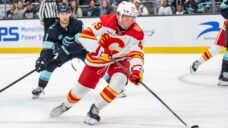Flames trim camp roster to 27 players with Basha, Brzustewicz assigned to AHL