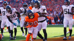 Denver Broncos running back Jonah Coleman (20) scores a touchdown against the Jacksonville Jaguars in the second half of an NFL football game in Denver, Sunday, Sept. 20, 2026. (David Zalubowski/AP)