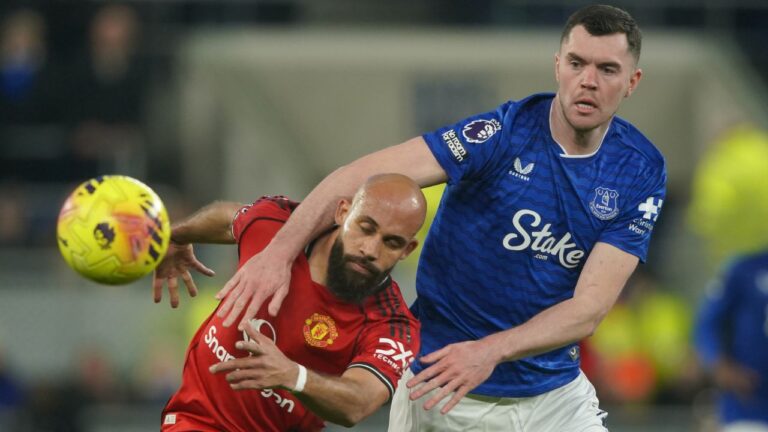 Manchester United's Bryan Mbeumo, left, and Everton's Michael Keane fight for the ball during the Premier League soccer match between Manchester United and Everton in Liverpool, England, Monday, Feb. 23, 2026. (Ian Hodgson/AP)