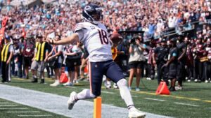 Chicago Bears quarterback Caleb Williams (18) runs to score a touchdown during the first half of an NFL football game, Sunday, Sept. 13, 2026, in Charlotte, N.C. (Scott Kinser/AP)