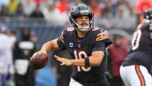 Chicago Bears quarterback Caleb Williams loos to pass during the first half of an NFL football game against the Minnesota Vikings. (Nam Y. Huh/AP)