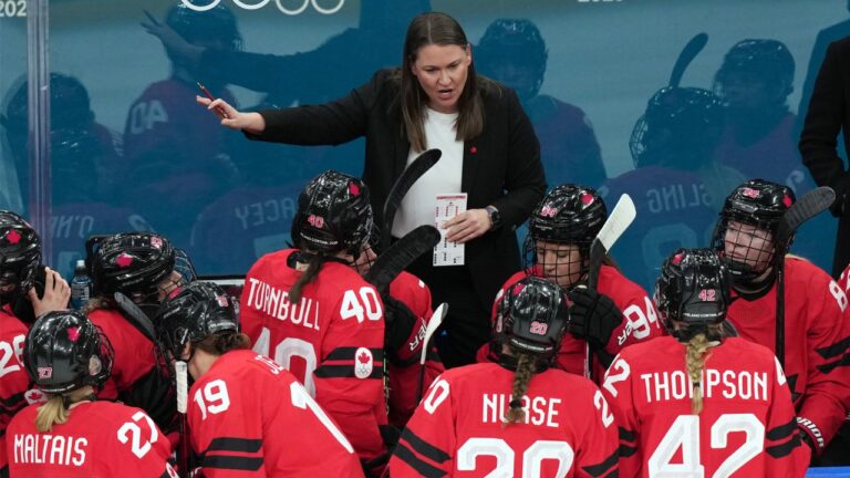 Canada assistant coach Kori Cheverie talks with her players during the first period of a women's ice hockey semifinal match against Switzerland at the 2026 Winter Olympics, in Milan, Italy, Monday, Feb. 16, 2026. (Carolyn Kaster/AP)