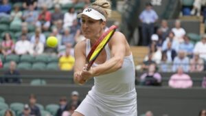 Gabriela Dabrowski of Canada plays return to Caroline Dolehide of the United States and Desirae Krawczyk of the United States during their semifinal doubles match at the Wimbledon tennis championships in London, Friday, July 12, 2024. (Alastair Grant/AP)