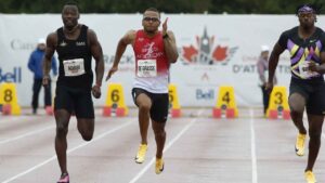 Andre De Grasse (centre) wins the senior men's 100m final during the Canadian Track and Field Championships in Ottaw. (Patrick Doyle/THE CANADIAN PRESS)
