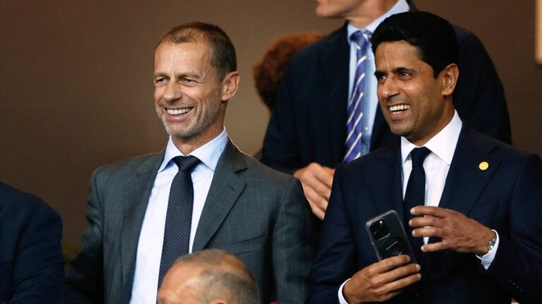 UEFA President Aleksander Ceferin, left, and Paris Saint-Germain Nasser Al-Khelaifi smile prior to the Champions League opening phase soccer match between Barcelona and Paris Saint-Germain at the Lluis Companys Olympic Stadium in Barcelona, Spain, Oct. 1, 2025. (Joan Monfort/AP)