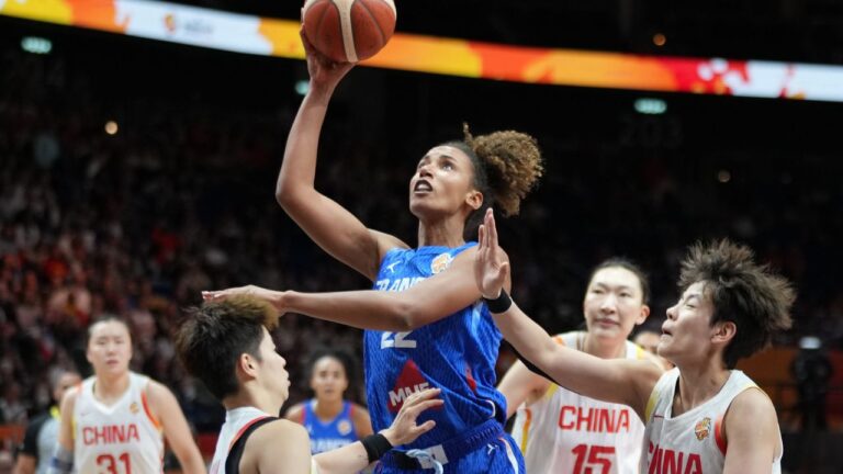 France's Marième Badiane shoots over China's Li Yuan during the Women's Basketball World Cup quarterfinal match between the China and France in Berlin, Thursday, Sept. 10, 2026. (Ebrahim Noroozi/AP)