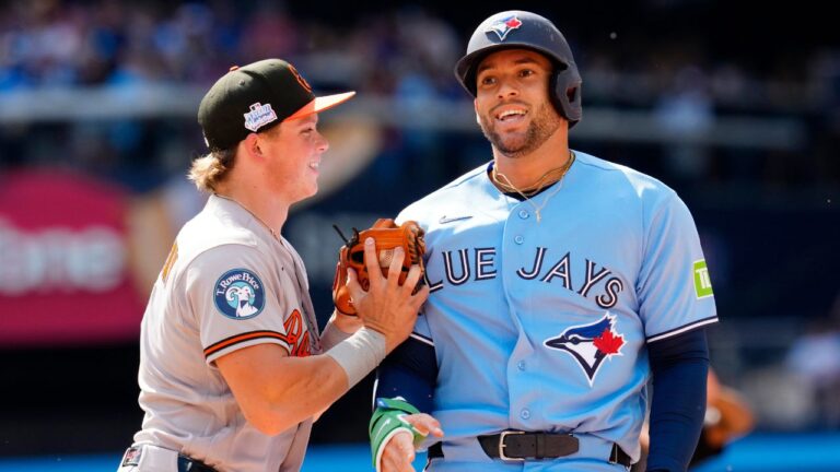 Toronto Blue Jays' George Springer (4) reacts after getting tagged by Baltimore Orioles shortstop Gunnar Henderson (2) during a rundown in fourth inning MLB baseball action in Toronto, Saturday, June 6, 2026. (Frank Gunn/CP)