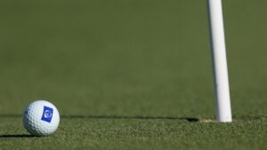 A golf ball lies near the pin. .(AP Photo/Bernat Armangue)