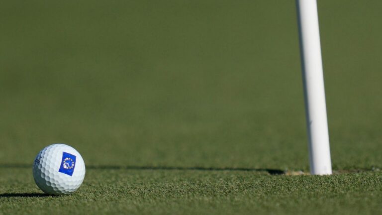 A golf ball lies near the pin. .(AP Photo/Bernat Armangue)