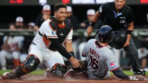 Baltimore Orioles catcher Samuel Basallo, left, tags Cleveland Guardians' Patrick Bailey (16) out at home plate during the second inning of a baseball game, Tuesday, Sept. 8, 2026, in Baltimore. (Stephanie Scarbrough/AP Photo)