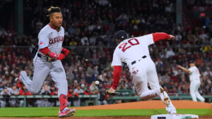 Cleveland Guardians' José Ramírez, left, dashes down the first base line as Boston Red Sox's Nick Sogard (20) steps away from the base on a single during the third inning of a baseball game, Thursday, Sept. 24, 2026, in Boston. (Charles Krupa/AP)