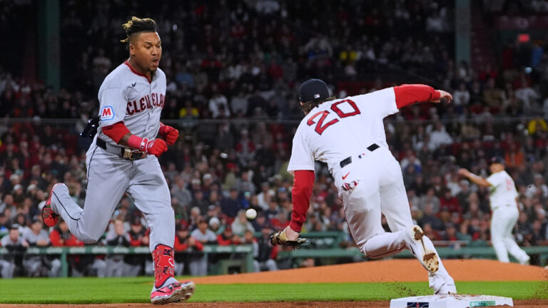 Cleveland Guardians' José Ramírez, left, dashes down the first base line as Boston Red Sox's Nick Sogard (20) steps away from the base on a single during the third inning of a baseball game, Thursday, Sept. 24, 2026, in Boston. (Charles Krupa/AP)