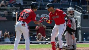 Cleveland Guardians' Steven Kwan (38) congratulates Brayan Rocchio, front right, after Rocchio hit a solo home run off Detroit Tigers starting pitcher Jackson Jobe during the fifth inning of a baseball game. (Phil Long/AP)