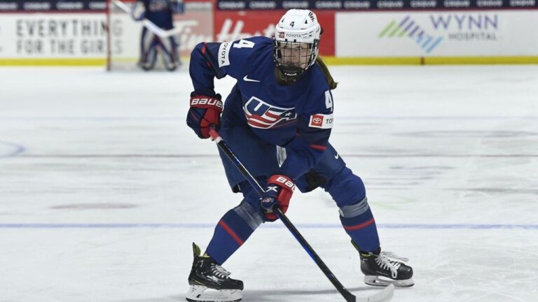United States defender Caroline Harvey (4) skates with the puck during the first period in the semifinals against Finland at the IIHF Women's World Hockey Championships in Utica, N.Y., Saturday, April 13, 2024. (Adrian Kraus/AP)