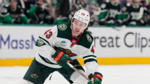 Minnesota Wild's Quinn Hughes handles the puck in Game 2 of a first-round NHL Stanley Cup playoffs hockey series against the Dallas Stars Monday, April 20, 2026, in Dallas. (Tony Gutierrez/AP)