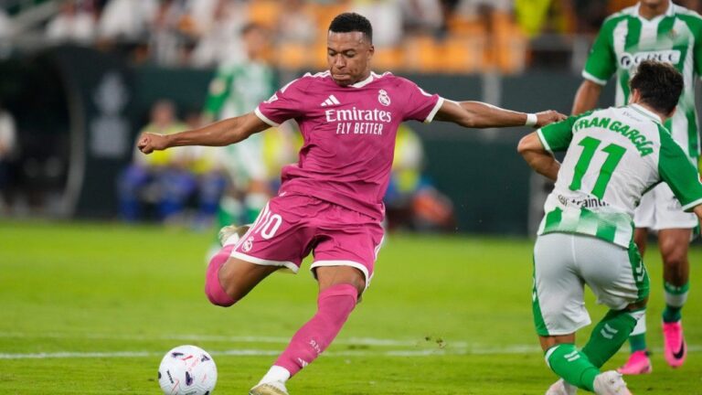 Real Madrid's Kylian Mbappe, left, attempts a shot on goal during the Spanish La Liga soccer match between Real Betis and Real Madrid in Seville, Spain, Friday, Sept. 4, 2026. (Jose Breton/AP)