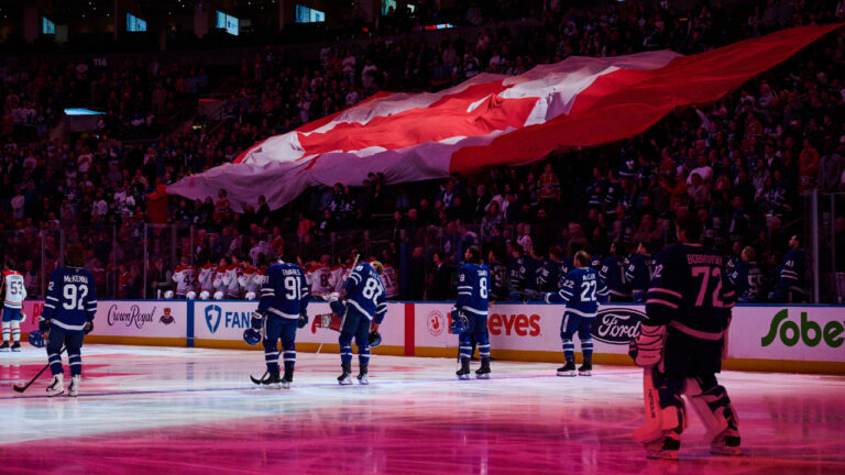 Players stand for the national anthem before NHL pre-season hockey action between the Toronto Maple Leafs and Montreal Canadiens in Toronto, on Saturday, Sept. 19, 2026. (Sammy Kogan/CP)