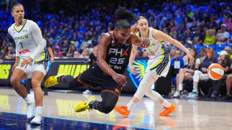 Phoenix Mercury forward Alyssa Thomas (25) falls and looses control of the ball against Dallas Wings defenders Alysha Clark (7) and Paige Bueckers, right, during the second half of a WNBA basketball game in Arlington, Texas, Saturday, Sept. 19, 2026. (LM Otero/AP)