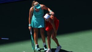 Mirra Andreeva, of Russia, left, helps Anastasia Potapova, of Austria, after Potapova fell during the fourth round of the U.S. Open tennis championships, Monday, Sept. 7, 2026, in New York. (Andres Kudacki/AP)