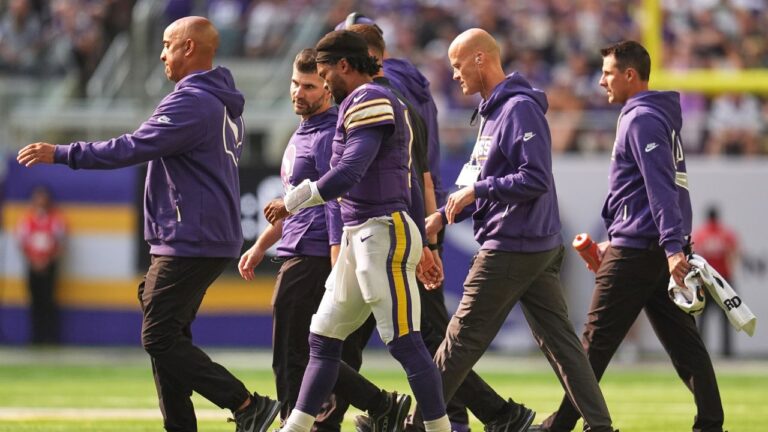 Minnesota Vikings quarterback Kyler Murray, center, walks off the field with staff after suffering an unknown injury during the first half of an NFL football game against the Green Bay Packers Sunday, Sept. 13, 2026, in Minneapolis, Minn. (Abbie Parr/AP)