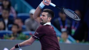 Novak Djokovic of Serbia returns a ball to Nuno Borges of Portugal during the first round in the men's singles match of the China Open tennis tournament in Beijing, Wednesday, Sept. 30, 2026. (Andy Wong/AP)