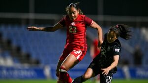 Canada's Olivia Smith, left, vies for the ball with South Korea's Choo Hyojoo during the international women's friendly soccer match between Canada and South Korea at the Pinatar Arena Football Center in Murcia, Spain, on Tuesday, Dec. 3, 2024. (Francisco Macia Martinez/AP)