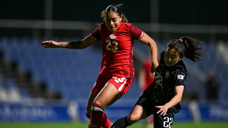 Canada's Olivia Smith, left, vies for the ball with South Korea's Choo Hyojoo during the international women's friendly soccer match between Canada and South Korea at the Pinatar Arena Football Center in Murcia, Spain, on Tuesday, Dec. 3, 2024. (Francisco Macia Martinez/AP)