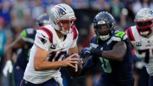 New England Patriots quarterback Drake Maye (10) runs with the ball during the first half of an NFL football game against the Seattle Seahawks, Wednesday, Sept. 9, 2026, in Seattle. (Stephen Brashear/AP Photo)