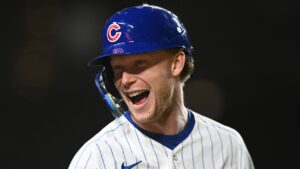 Chicago Cubs' Pete Crow-Armstrong jokes with Miami Marlins players in the dugout during the sixth inning of a baseball game Tuesday, Sept. 22, 2026, in Chicago. (Paul Beaty/AP Photo)