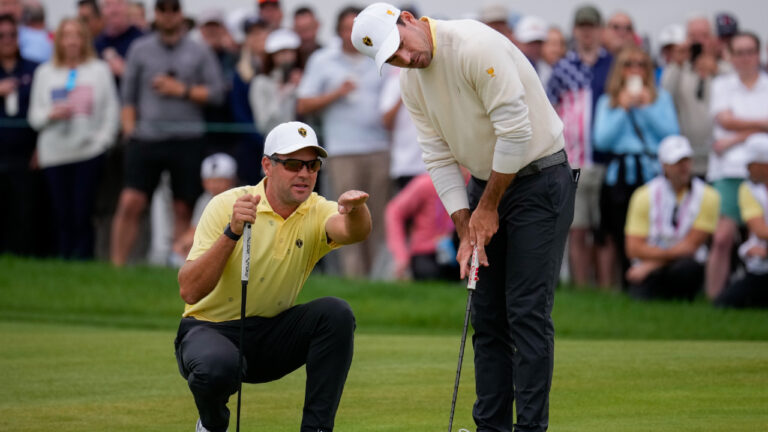 International teams' Corey Conners, of Canada, left, and Nick Taylor, of Canada, line up their shot on the seventh green against the USA team during the Presidents Cup golf tournament second round foursomes match at Medinah Country Club, Friday, Sept. 25, 2026, in Medinah, Ill. (Matt Slocum/AP)