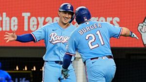 Texas Rangers' Wyatt Langford, left, and Jake Burger (21) celebrate Burger's two-run home run that scored Langford during the fourth inning of a baseball game against the Tampa Bay Rays Sunday, Sept. 6, 2026, in Arlington, Texas. (Tony Gutierrez/AP)