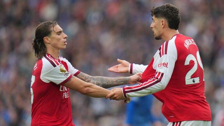 Arsenal's Riccardo Calafiori pulls Kai Havertz during the English Premier League soccer match between Brighton & Hove Albion and Arsenal in Brighton, England, Saturday, Sept. 19, 2026. (Kin Cheung/AP)