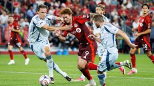 Toronto FC's Josh Sargent, centre, attempts to dribble past Chicago Fire FC's Jack Elliott (3), left, during second half MLS action in Toronto, on Saturday, Sept. 5, 2026. (Keito Newman/CP)