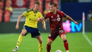 Toronto FC's Jackson Gilman (right) shields the ball form Nashville SC's Sam Surridge (9) during first half MLS action in Toronto, on Wednesday, Sept. 9, 2026. (Keito Newman/CP)