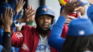 Toronto Blue Jays' Vladimir Guerrero Jr. is congratulated by his teammates after hitting a three-run home run off Cleveland Guardians starting pitcher Joey Cantillo during the second inning of a baseball game, Wednesday, Sep. 2, 2026, in Cleveland. (Phil Long/AP Photo)