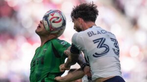 Vancouver Whitecaps' Tristan Blackmon, front right, and Austin FC's Christian Ramirez vie for the ball during the first half of an MLS soccer match, in Vancouver, on Sunday, Sept. 13, 2026. (Darryl Dyck/THE CANADIAN PRESS)