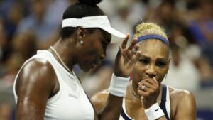 Venus Williams, left, and Serena Williams, of the United States, confer as they play against Hao-Ching Chan, of Taiwan, and Maya Joint, of Australia, during a women's doubles match at the U.S. Open tennis championships, Friday, Sept. 4, 2026, in New York. (Adam Hunger/AP)