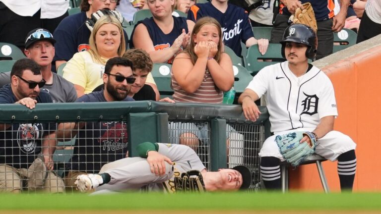 Athletics left fielder Zack Gelof grabs his leg after contacting the wall while catching a Detroit Tigers' Zach McKinstry fly ball in foul territory during the third inning of a baseball game Thursday, July 9, 2026, in Detroit. (Paul Sancya/AP)