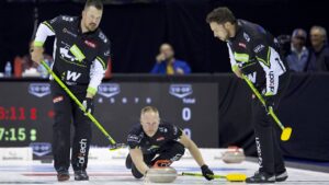 Ben Hebert (left) and Brett Gallant (right) get ready to sweep Brad Jacobs’ (middle) rock during their semifinal match against Switzerland’s Yannick Schwaller at Co-op Invitational final on Saturday Oct. 17, 2026, in Victoria, B.C. (Anil Mungal/TCG)