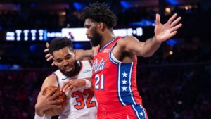 New York Knicks' Karl-Anthony Towns, left, drives to the basket against Philadelphia 76ers' Joel Embiid, right, during the first half of an NBA Cup basketball game, Friday, Oct. 30, 2026, in Philadelphia. (Chris Szagola/AP)
