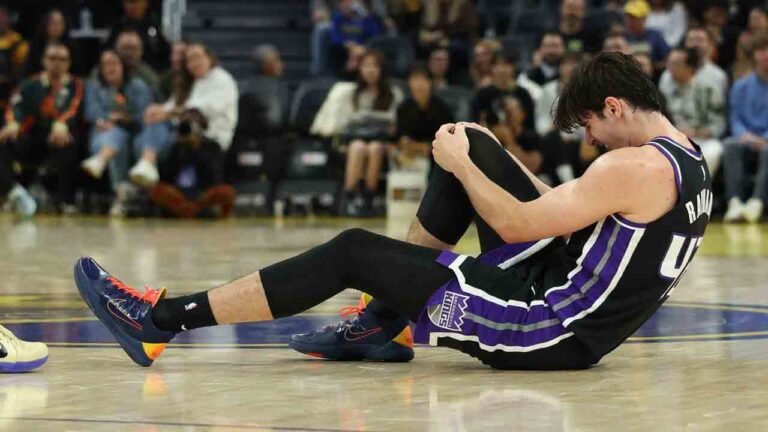 Sacramento Kings center Maxime Raynaud (42) grabs his knee during the first half of an NBA preseason basketball game against the Golden State Warriors in San Francisco, Saturday, Oct. 10, 2026. (Jed Jacobsohn/AP)