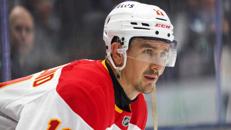 Calgary Flames centre Mikael Backlund looks on during warmups before an NHL hockey game against the Seattle Kraken, Sunday, Oct. 4, 2026, in Seattle. (Jason Redmond/AP)