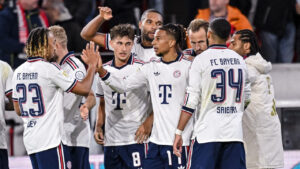 Bayern's Michael Olise, centre right, celebrates with teammates after scoring his side's third goal during the German Bundesliga soccer match between SC Freiburg and FC Bayern Munich in Freiburg, Germany, Sunday, Oct. 25, 2026. (Harry Langer/dpa via AP)