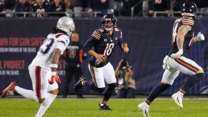 Chicago Bears quarterback Caleb Williams (18) scrambles as during the second half of an NFL football game against the New England Patriots in Chicago, Thursday, Oct. 22, 2026. (Nam Y. Huh/AP)