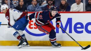 Winnipeg Jets' Viggo Bjorck (61) drives for the net as he gets past Colorado Avalanche's Sam Malinski (70) during second period NHL hockey action in Winnipeg on Wednesday, Oct. 7, 2026. (John Woods/CP)